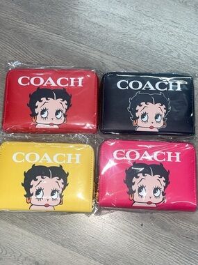 COACH Betty Boop Zip Wallets in Red, Black, Yellow, and Pink